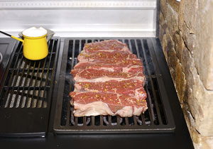 grilling steaks on an electric grill