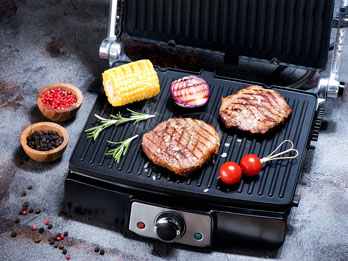 burgers and veggies on an indoor grill